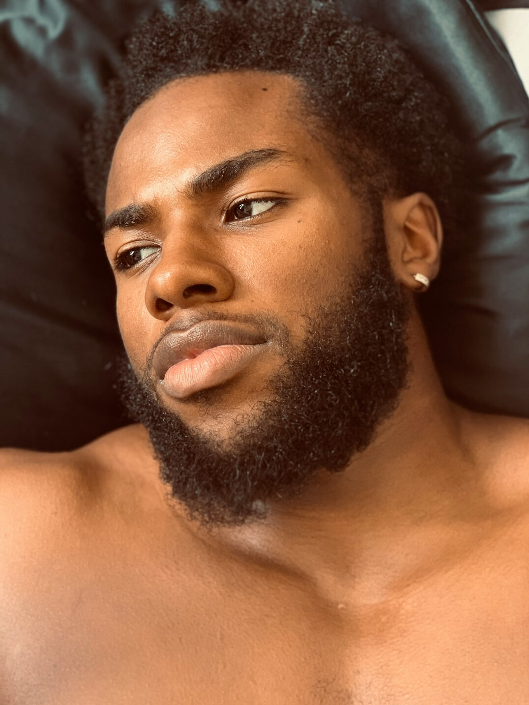 Portrait of a Black British man with a short beard